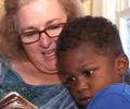 white woman and adopted black baby