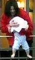 Michael Jackson dangles baby