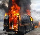 A police van on fire in Baltimore, Maryland on April 27, 2015 during a riot.